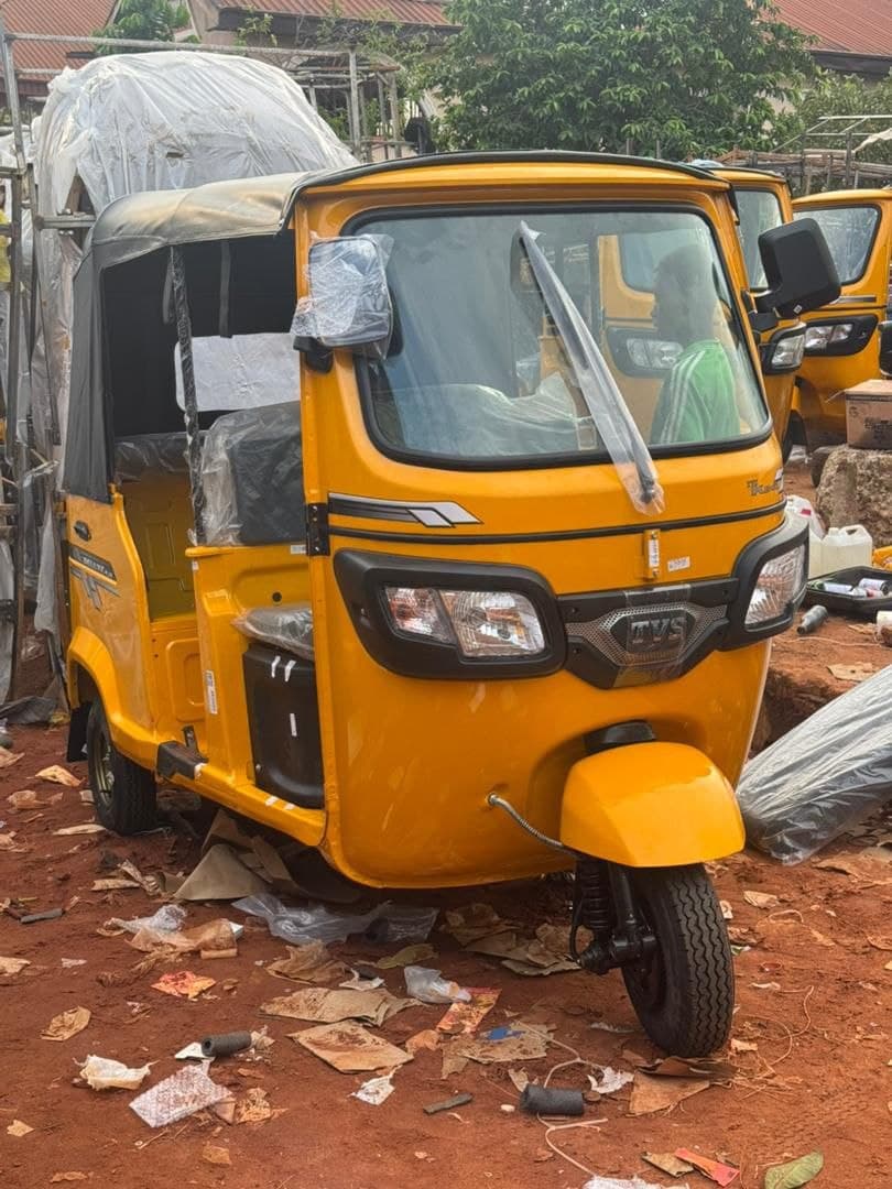 Orange petrol commercial tricycle